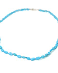 pale blue kingman turquoise beads are strung together on lavender silk in this nautical necklace, with a silver fish hook clasp