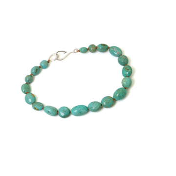 seafoam green turquoise beads knotted on brown silk with silver fish hook clasp