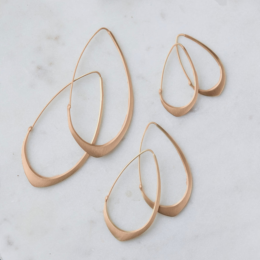 Photo of all three pairs of facet hoops in 14k rose gold in three sizes: large, medium, small