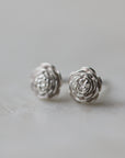 large pair of silver rose earrings studs.