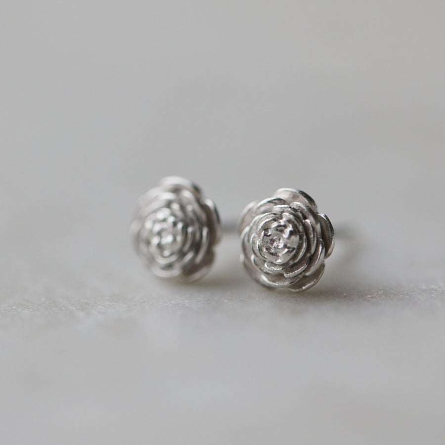 large pair of silver rose earrings studs.