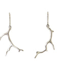 Silver Branch Coral Ruthie B. Earrings on white background.