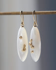 large sized mother of pearl drop earrings with gold barnacles