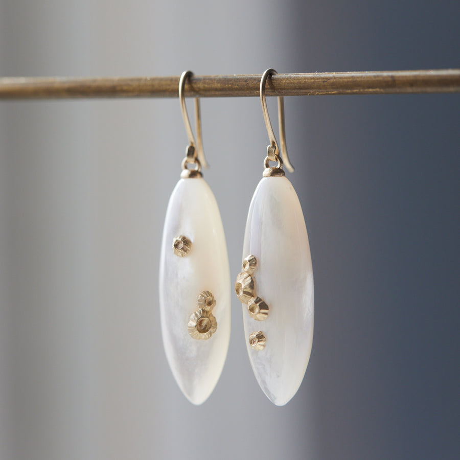 large sized mother of pearl drop earrings with gold barnacles