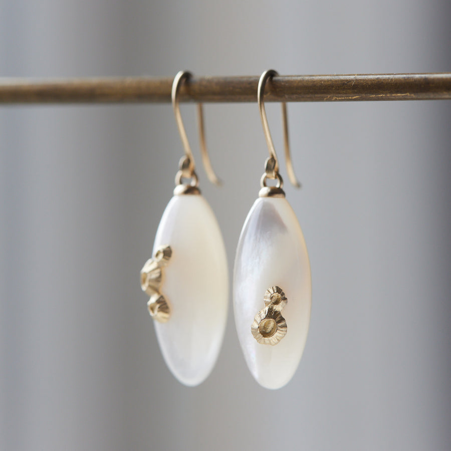 medium sized mother of pearl drop earrings with gold barnacles