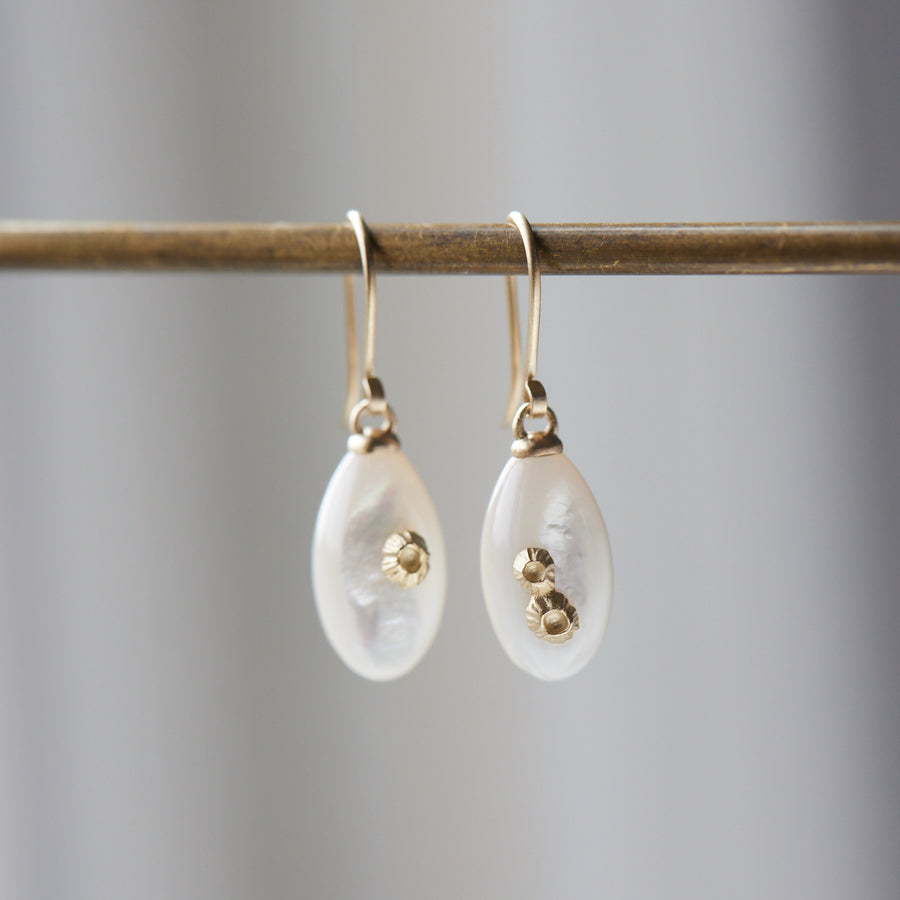 small sized mother of pearl drop earrings with gold barnacles