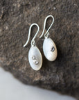 small sized mother of pearl drop earrings with silver barnacles