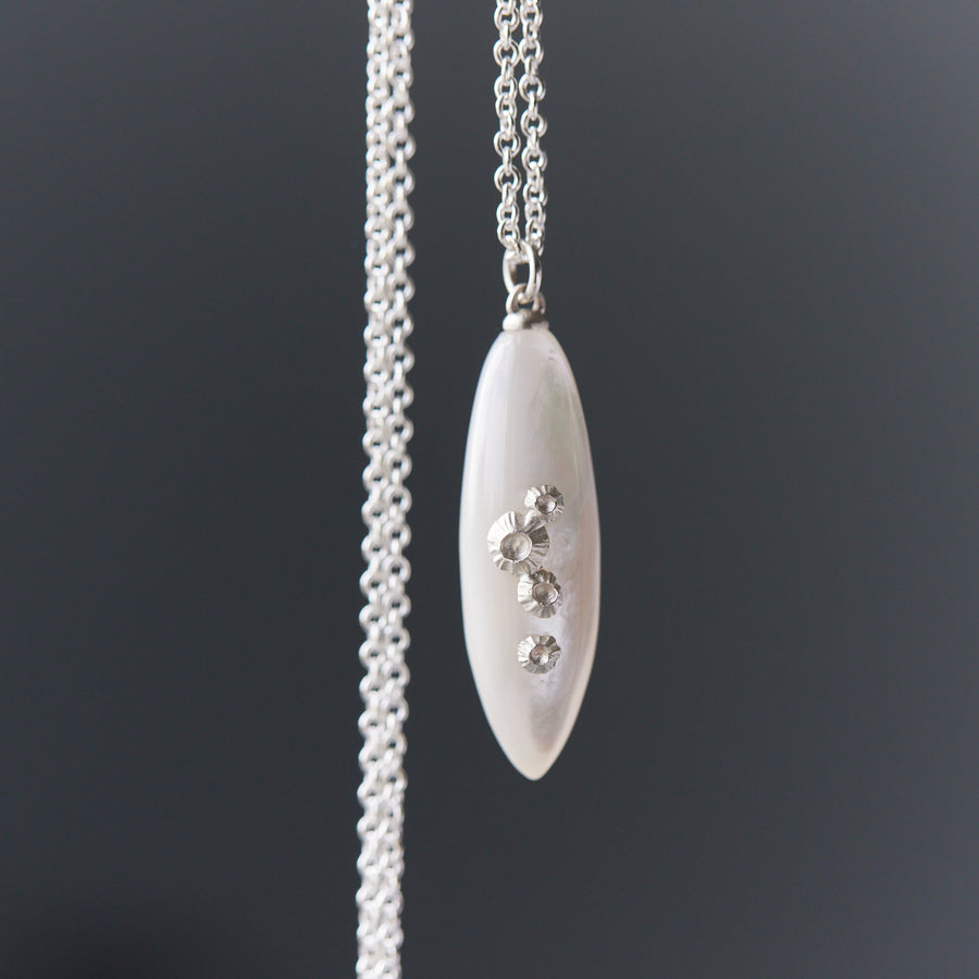 large sized mother of pearl pendant necklace in bright silver with barnacles