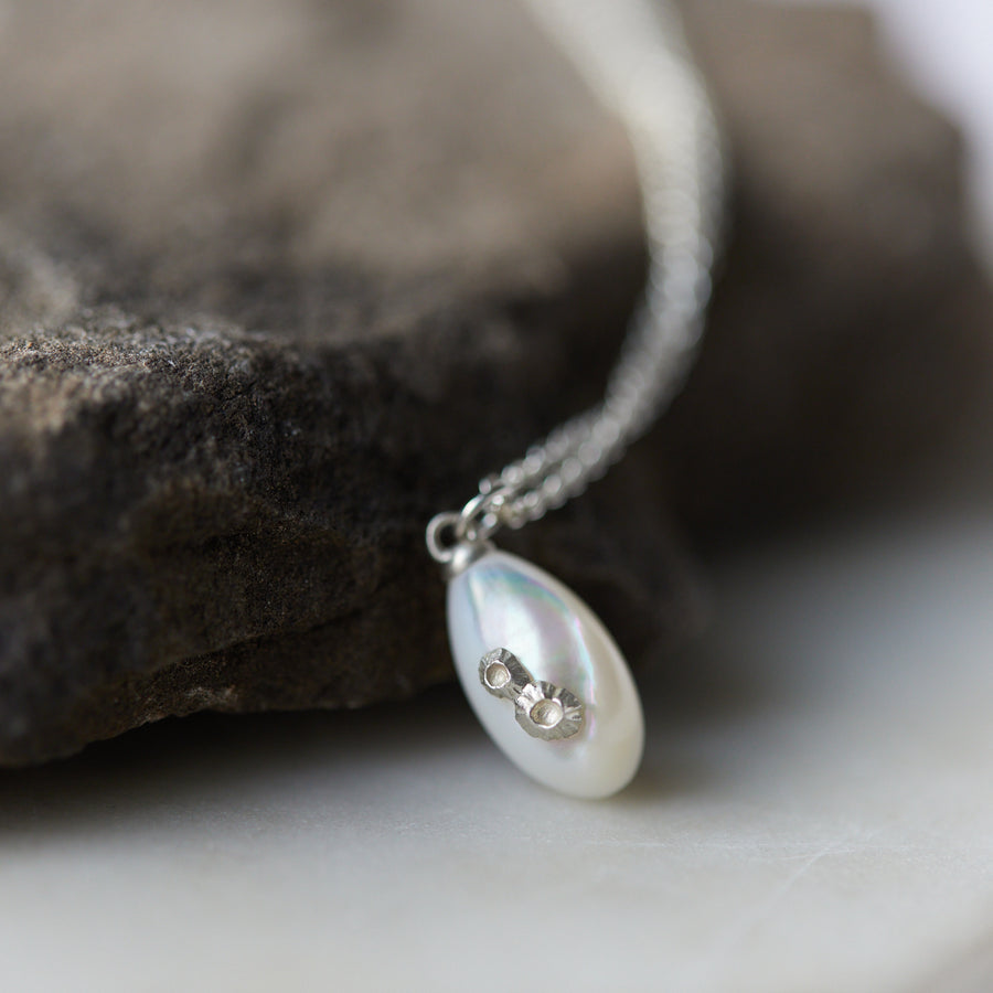 little sized mother of pearl pendant necklace in bright silver with barnacles