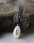 little sized mother of pearl pendant necklace in oxidized silver with 14k gold barnacles