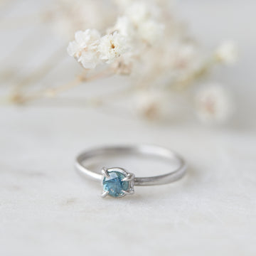 blue montana sapphire stone set in a ring of platinum via prongs