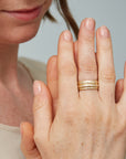 Ovoid gold bands with diamonds by Hannah Blount