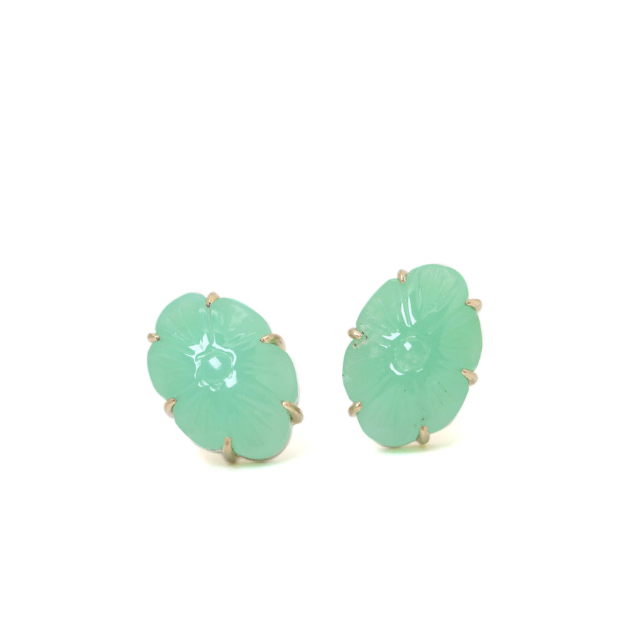 13.06ct Carved Chrysoprase Studs on a white background. The Carved Chrysoprase is set with six 14k gold prongs. The Carved Chrysoprase is oval shaped with a carved flower motif.