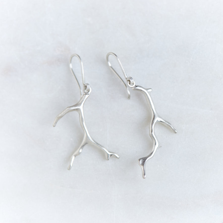 Two bright sterling silver branch coral earrings.