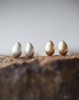 Silver and gold egg studs by Hannah Blount