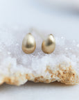 Gold egg studs by Hannah Blount