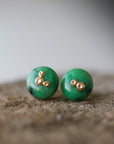 medium green garnet earring studs with gold barnacles