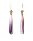 purple and white mottled quahog shell teardrops hang beneath gold ear wires with gold roses