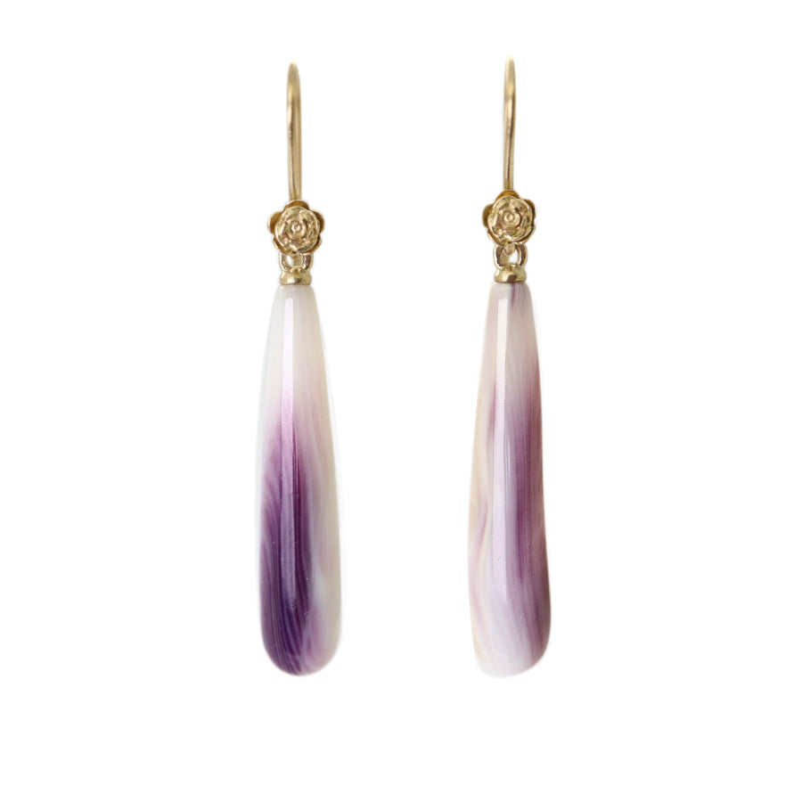 purple and white mottled quahog shell teardrops hang beneath gold ear wires with gold roses