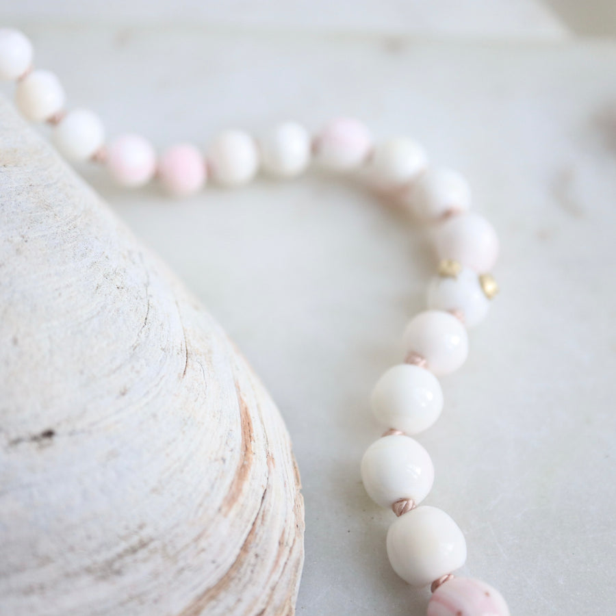 coral strand necklace with gold barnacles