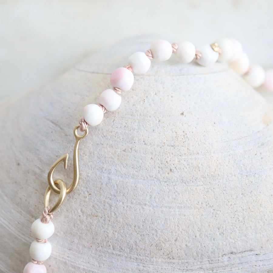 coral strand necklace with gold fish hook clasp