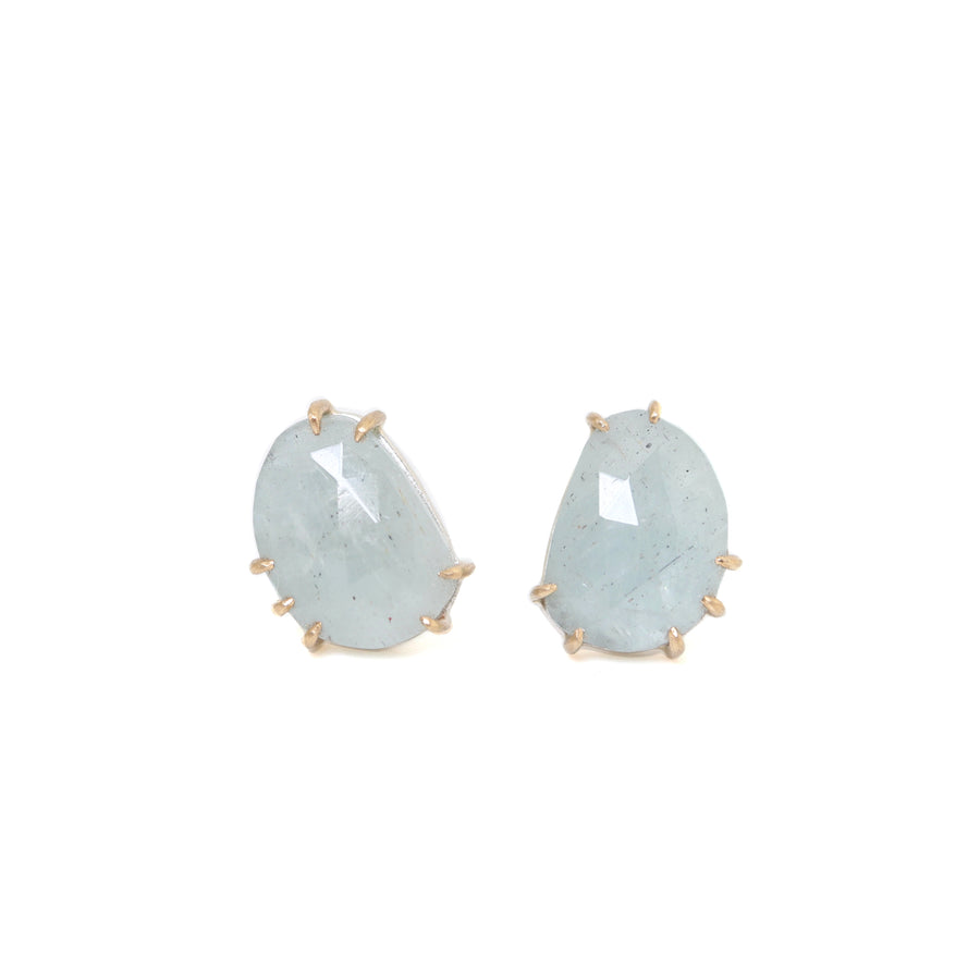 pale grey blue aquamarine stones with gold prongs. stud earrings