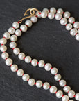 knotted freshwater pearls on red silk