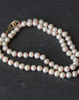 knotted freshwater pearls on red silk