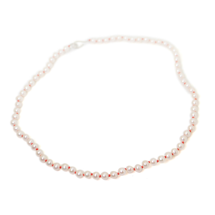 Freshwater pearls with coral thread