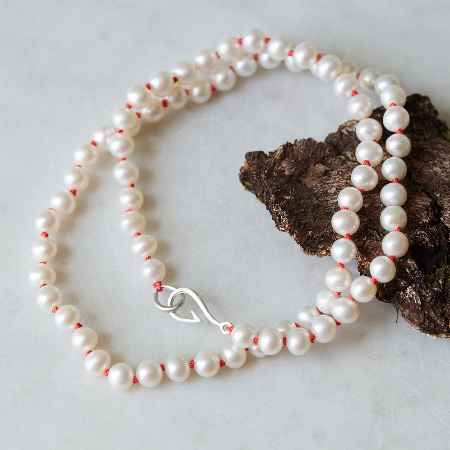 knotted freshwater pearls on coral silk