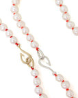 Freshwater pearls with coral thread