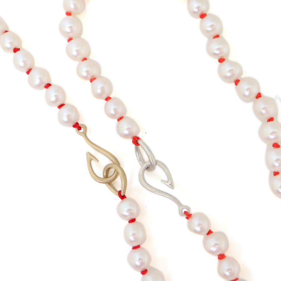 Freshwater pearls with coral thread