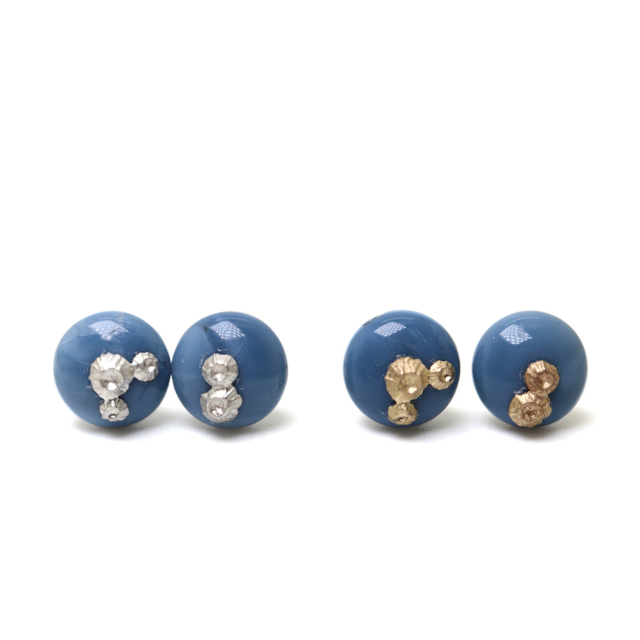 two pairs of blue common opal earring studs, left pair with silver barnacles and the right pair has gold barnacles.