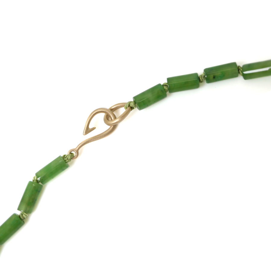 Green jade strand necklace with gold clasp by Hannah Blount