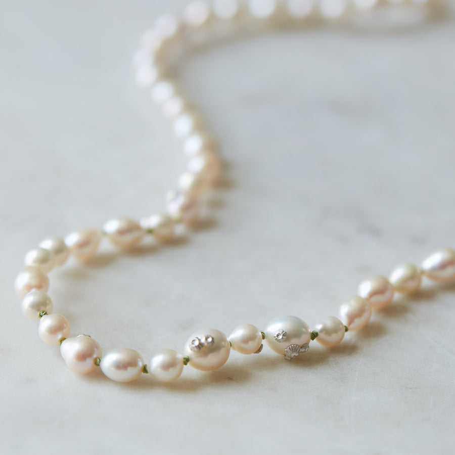 double pearl strand on green silk with silver barnacles