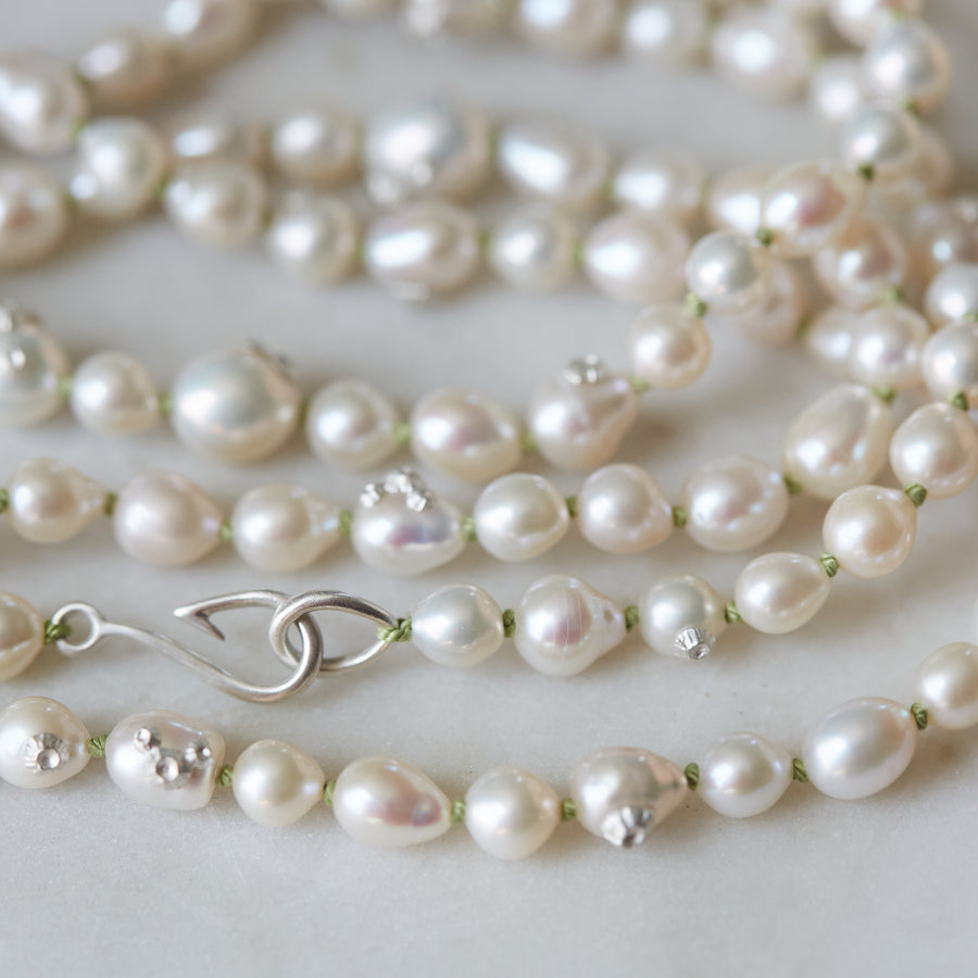 double pearl strand on green silk with silver barnacles