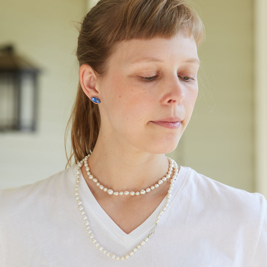 double pearl strand on green silk with silver barnacles on person