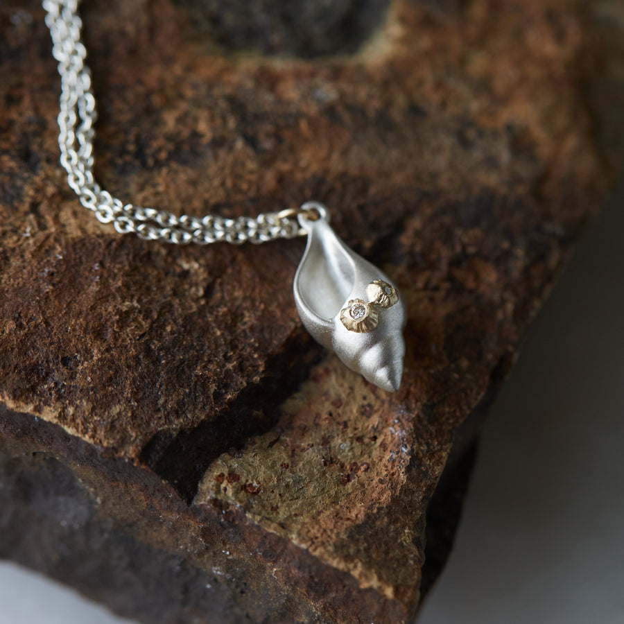 silver spiral tulip shell with two gold barnacles with diamonds, on a silver chain