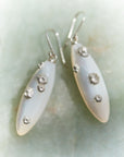 Large mother of pearl earrings with silver barnacles by Hannah Blount