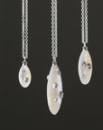 Mother of pearl necklace with silver barnacles by Hannah Blount